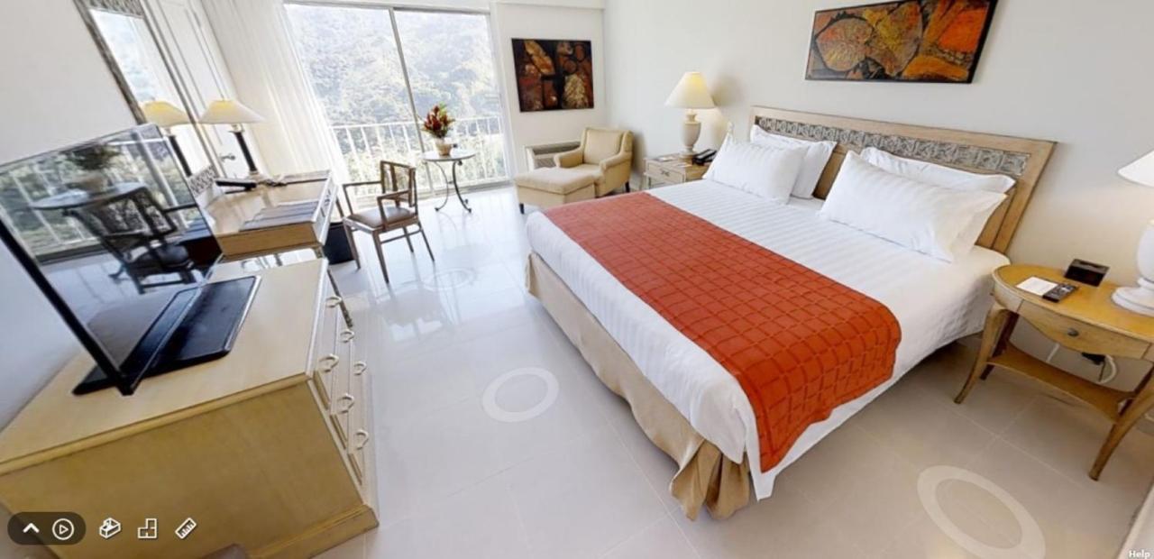 Hotel Estelar Altamira Ибаге Экстерьер фото A room at the hotel