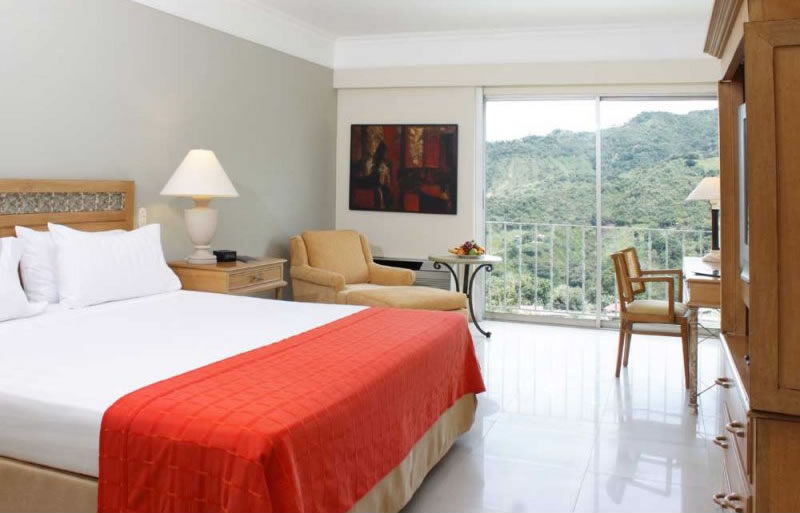 Hotel Estelar Altamira Ибаге Экстерьер фото A room at the hotel